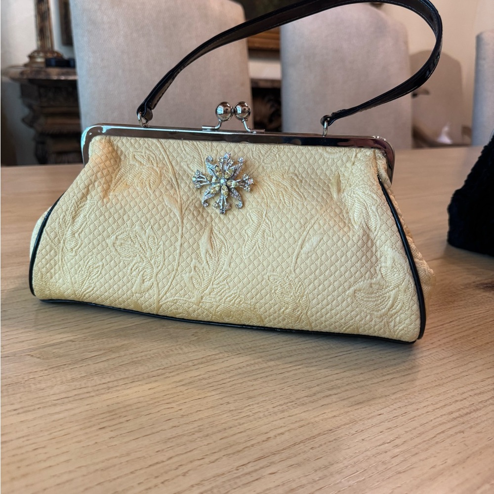 Chic  soft yellow  lady  Bag with black patent handle and trim. Silver Detailin.